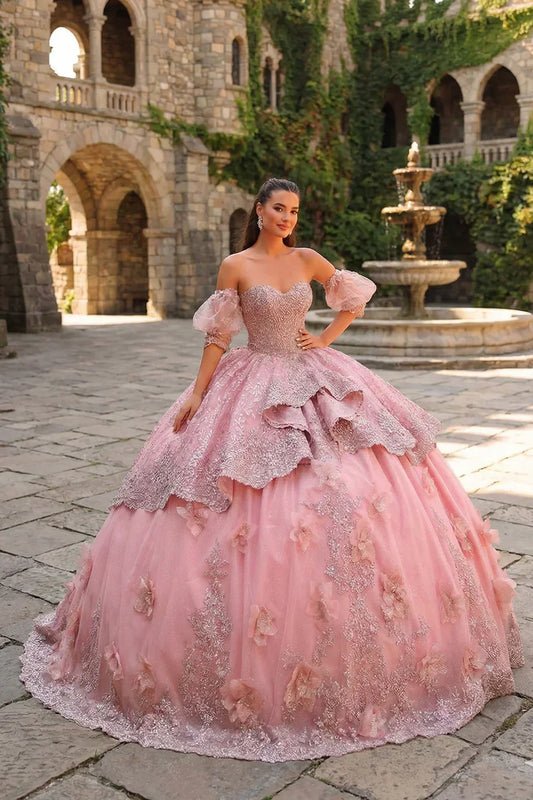 Pink textured ruffle ball gown with 3D floral embroidery and off-shoulder sleeves outdoors